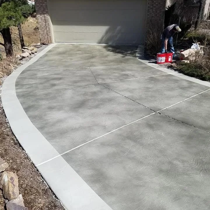 Decorative concrete floor with metallic epoxy finish in a residential garage